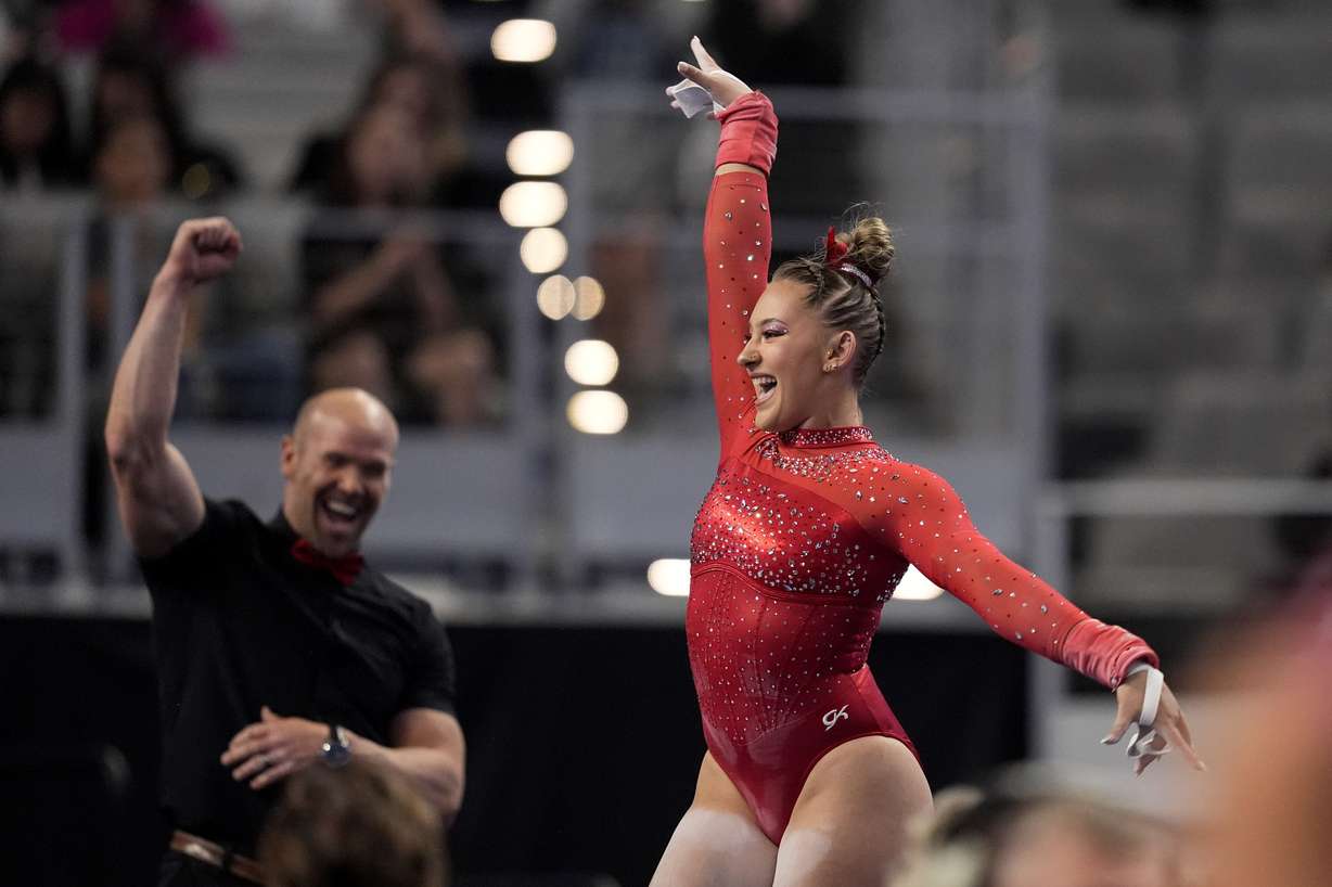 Utah's Makenna Smith celebrates after her uneven-bars routine during the NCAA women's gymnastics championships in Fort Worth, Texas, Thursday, April 18, 2024.