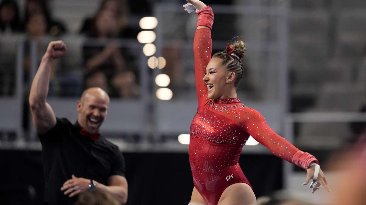Utah's Makenna Smith celebrates after her uneven-bars routine during the NCAA women's gymnastics championships in Fort Worth, Texas, Thursday, April 18, 2024.