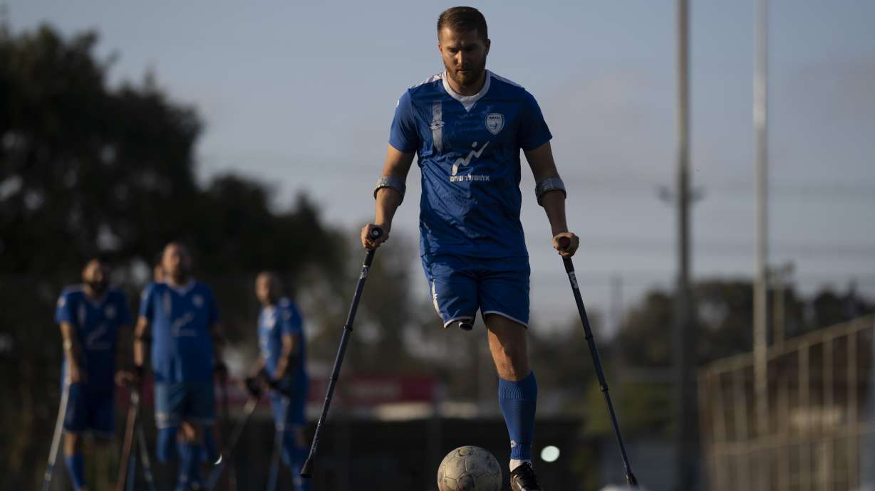 The soccer player of Israel Amputee Football Team, Ben Binyamin controls the ball during a practice session in Ramat Gan, Thursday, April 11, 2024. Ben Binyamin was celebrating his 29th birthday at the Tribe of Nova music festival on Oct. 7 when Hamas militants stormed into southern Israel and opened fire on thousands of Israelis dancing to electronic music. Binyamin raced into an air raid shelter, but attackers fired shots and then threw in grenades. He was seriously wounded; his right leg was blown off. He was left for dead.