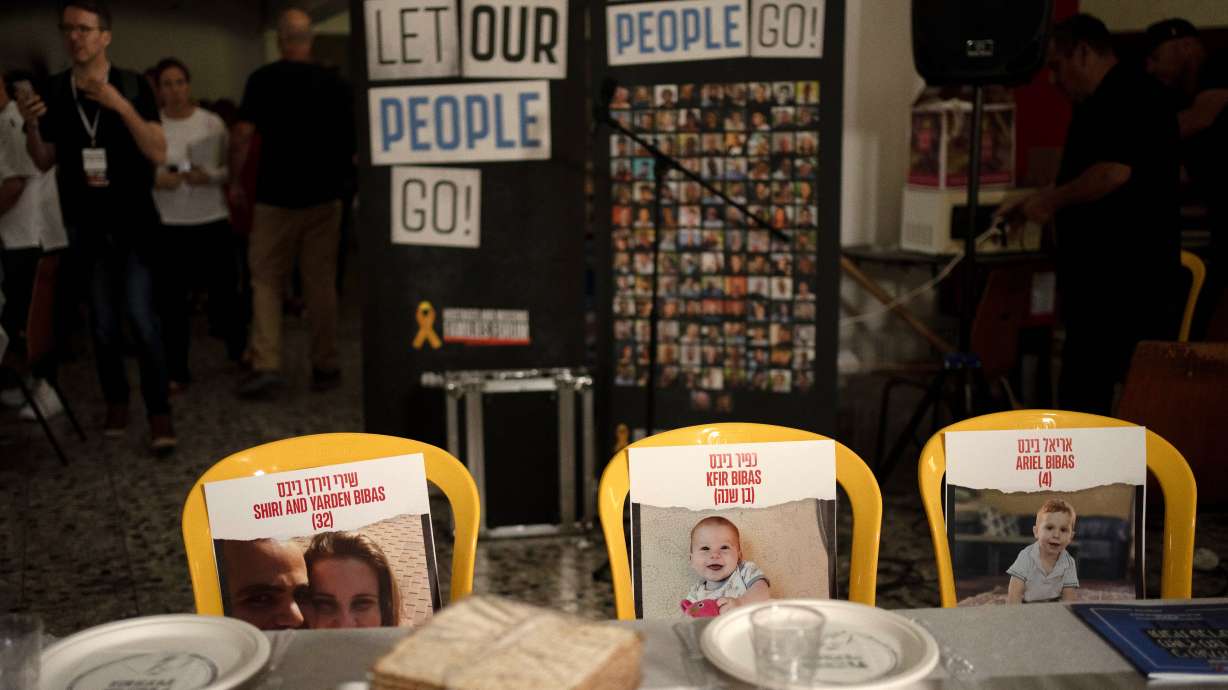 Chairs for the Bibas family, hostages in Gaza, at a Passover Seder table on April 11, at Kibbutz Nir Oz in southern Israel. The attack by Hamas on Israel and subsequent spike in antisemitic incidents has left Utah Jews with mixed sentiments as Passover looms.