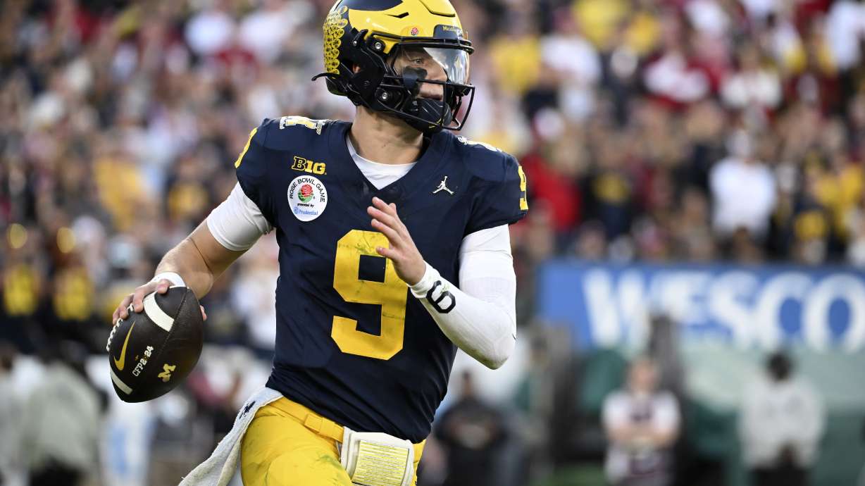 FILE - Michigan quarterback J.J. McCarthy (9) rolls out during the second half of the Rose Bowl CFP NCAA semifinal college football game against Alabama Monday, Jan. 1, 2024, in Pasadena, Calif. McCarthy is a possible first round pick in the NFL Draft.