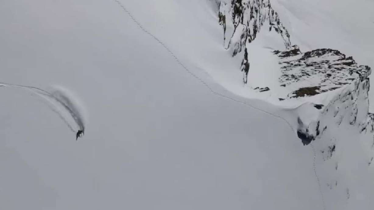A skier makes his way down Monte Rosa Massif in the Swiss Alps, on the Italy side, on July 21, 2021.