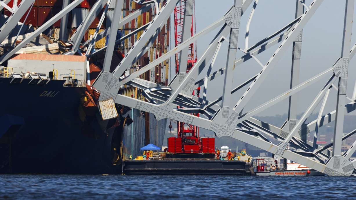 Salvage work continues on the collapsed Francis Scott Key Bridge, Monday, in Baltimore. The FBI confirmed that agents were aboard the Dali conducting court-authorized law enforcement activity.