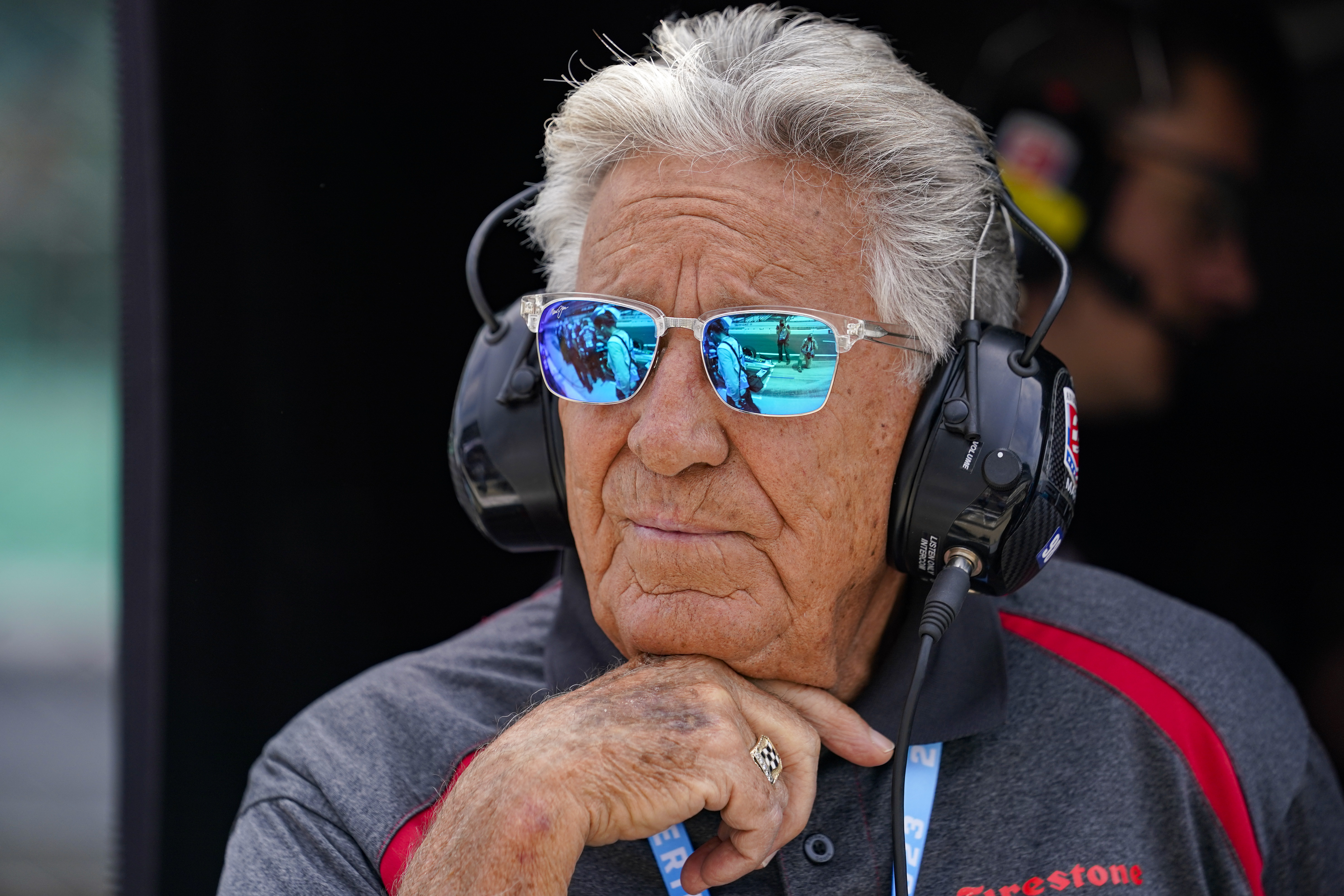 FILE - 1969 Indy 500 champion Mario Andretti watches from his grandson Marco Andretti's pit area during practice for the Indianapolis 500 auto race at Indianapolis Motor Speedway in Indianapolis, May 19, 2023. Mario said Friday, April 19, 2024, he was "offended" by the reasons given by Formula One for denying his family the chance to join the global motorsports series.