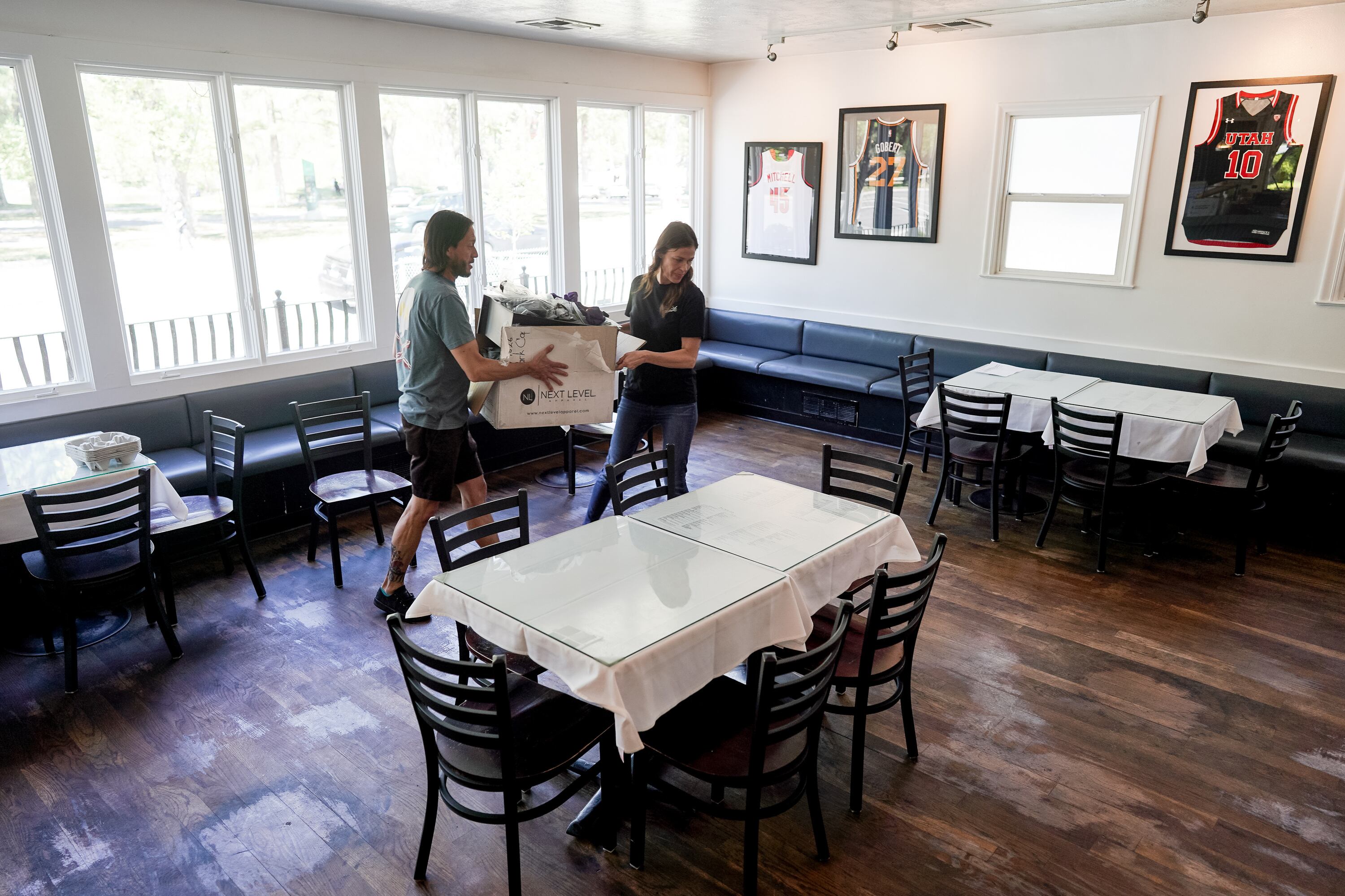 Sean Miller, owner of The Park Cafe, and his girlfriend, Tina Chante, move a box on April 28, 2020, as they prepare to reopen the Salt Lake City restaurant for dine-in service. A majority of American voters believe COVID-19 public health measures infringed on personal freedoms, according to a new Deseret News poll.