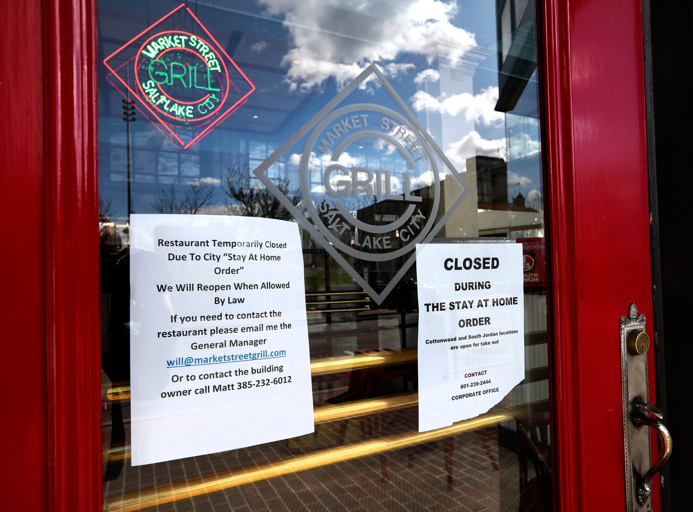 Signs at Market Street Grill in Salt Lake City on April 13, 2020, inform customers that the restaurant is closed during the COVID-19 pandemic.