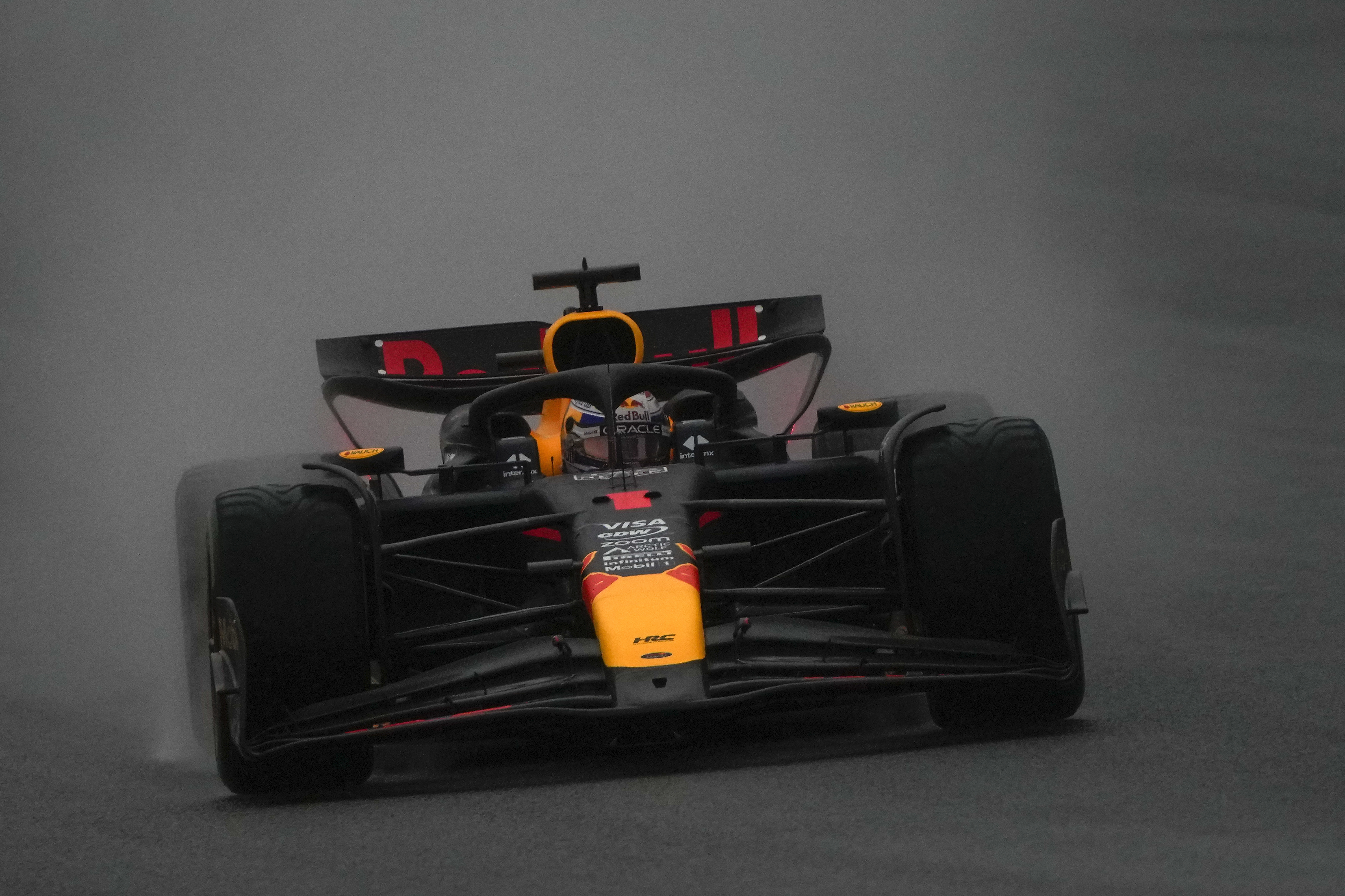 Red Bull driver Max Verstappen of the Netherlands steers his car in the rain during the sprint qualifying session for the Chinese Formula One Grand Prix at the Shanghai International Circuit, Shanghai, China, Friday, April 19, 2024.