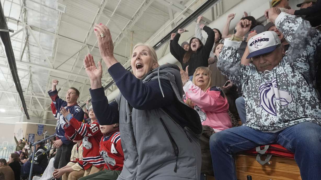 Julie Brian, center, of Layton, Utah, celebrates as the Ogden Mustangs score against the Utah Outliers during the Mountain Division Championship game Wednesday, April 17, 2024, in West Valley City, Utah. It may look like an NHL team has just fallen into Salt Lake City's lap. But local organizers say the Arizona Coyotes' relocation to Utah is the product of a yearslong effort to beckon professional hockey and other elite sports to the capital city.