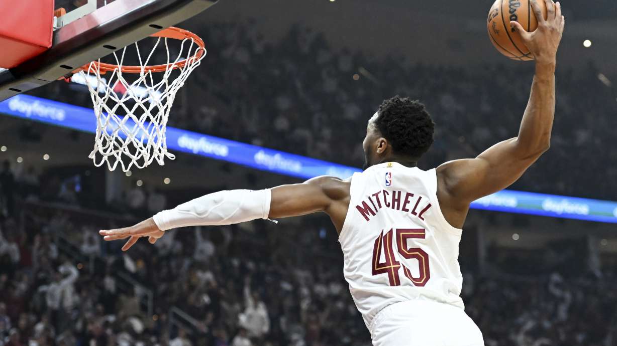 Cleveland Cavaliers' Donovan Mitchell dunks during the first half against the Orlando Magic in Game 1 of an NBA basketball first-round playoff series, Saturday, April 20, 2024, in Cleveland.