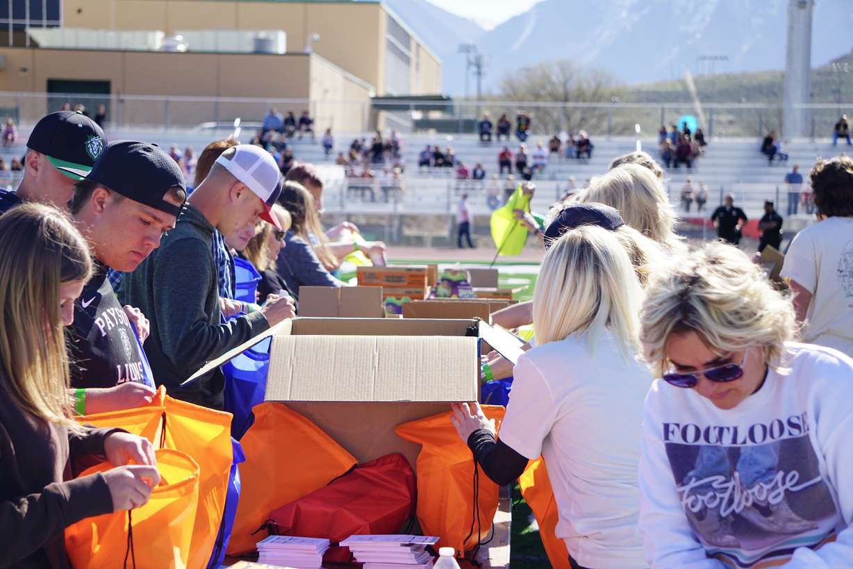 Students and community members build care packages for local organizations with Kevin Bacon’s charity Six Degrees at Payson High School in Payson on Saturday.