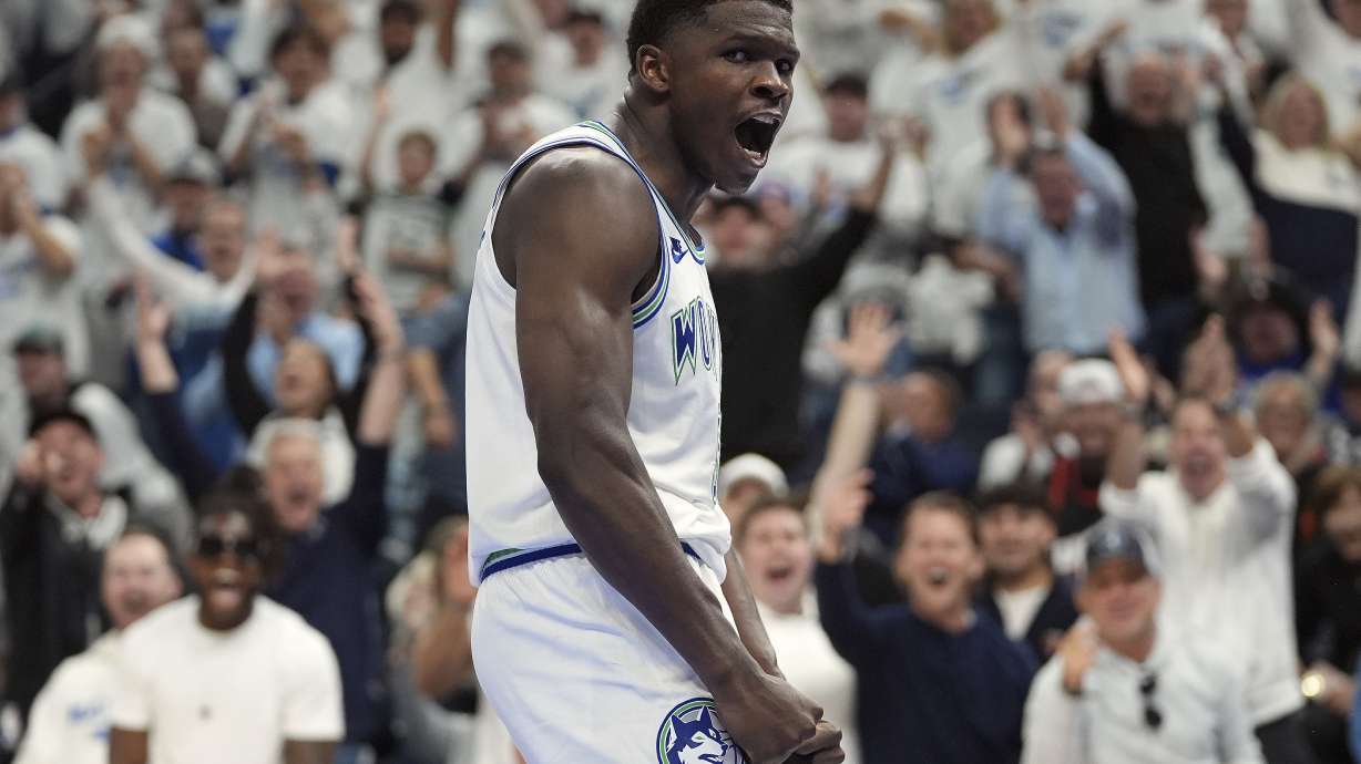 Minnesota Timberwolves guard Anthony Edwards celebrates after a dunk during the second half of Game 1 of an NBA basketball first-round playoff series against the Phoenix Suns, Saturday, April 20, 2024, in Minneapolis.