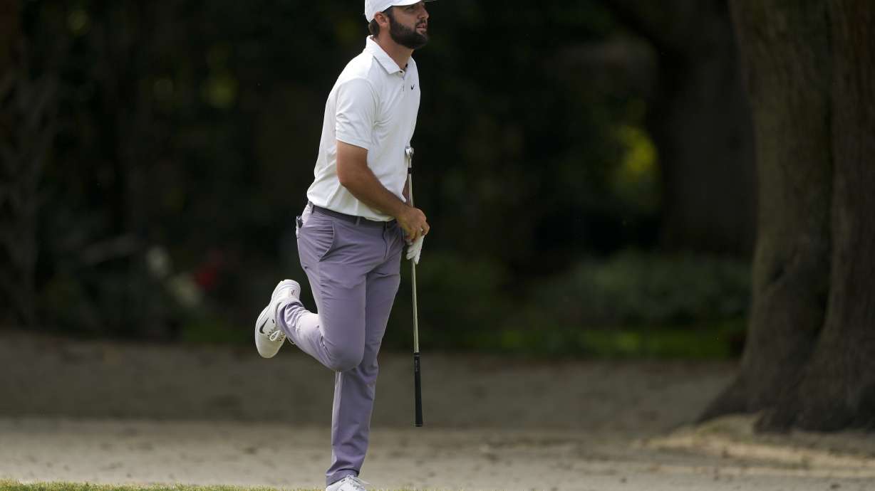 Scottie Scheffler hits from the fairway on the 15th hole during the third round of the RBC Heritage golf tournament, Saturday, April 20, 2024, in Hilton Head Island, S.C.