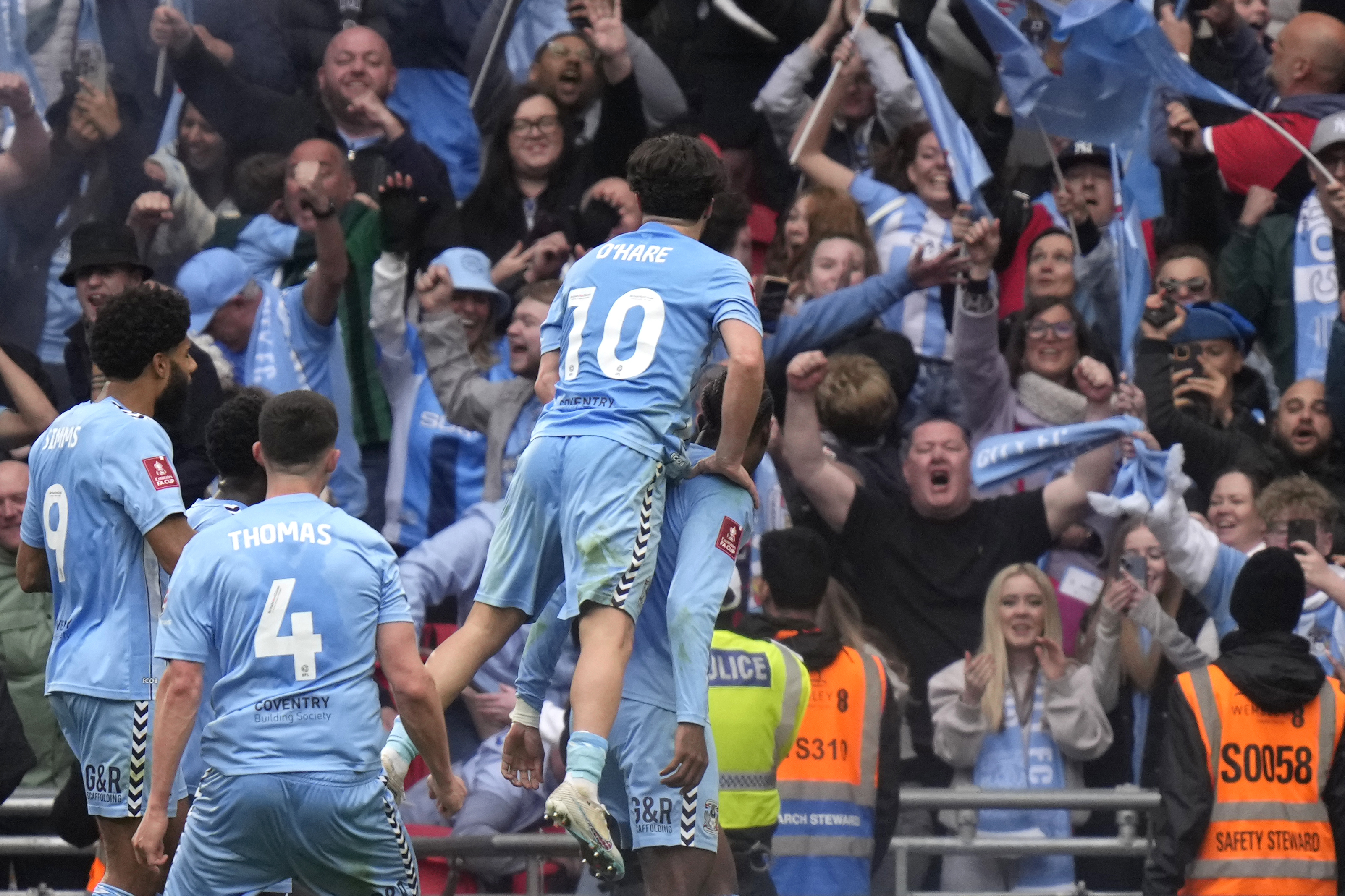 Coventry City players celebrate after scoring during the English FA Cup semifinal soccer match between Coventry City and Manchester United at Wembley stadium in London, Sunday, April 21, 2024. 