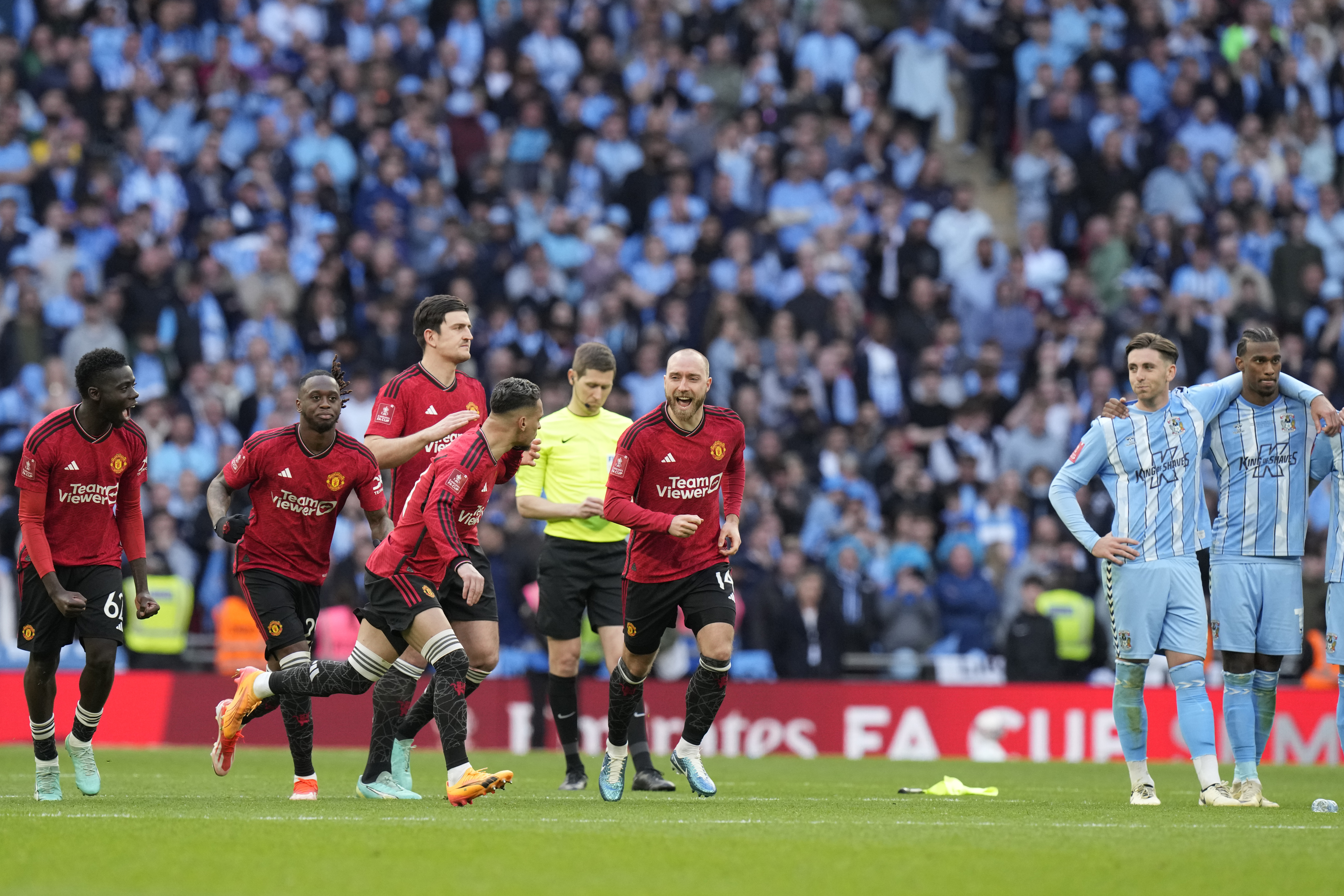 Manchester United players react during a penalty shootout at the end of the English FA Cup semifinal soccer match between Coventry City and Manchester United at Wembley stadium in London, Sunday, April 21, 2024.