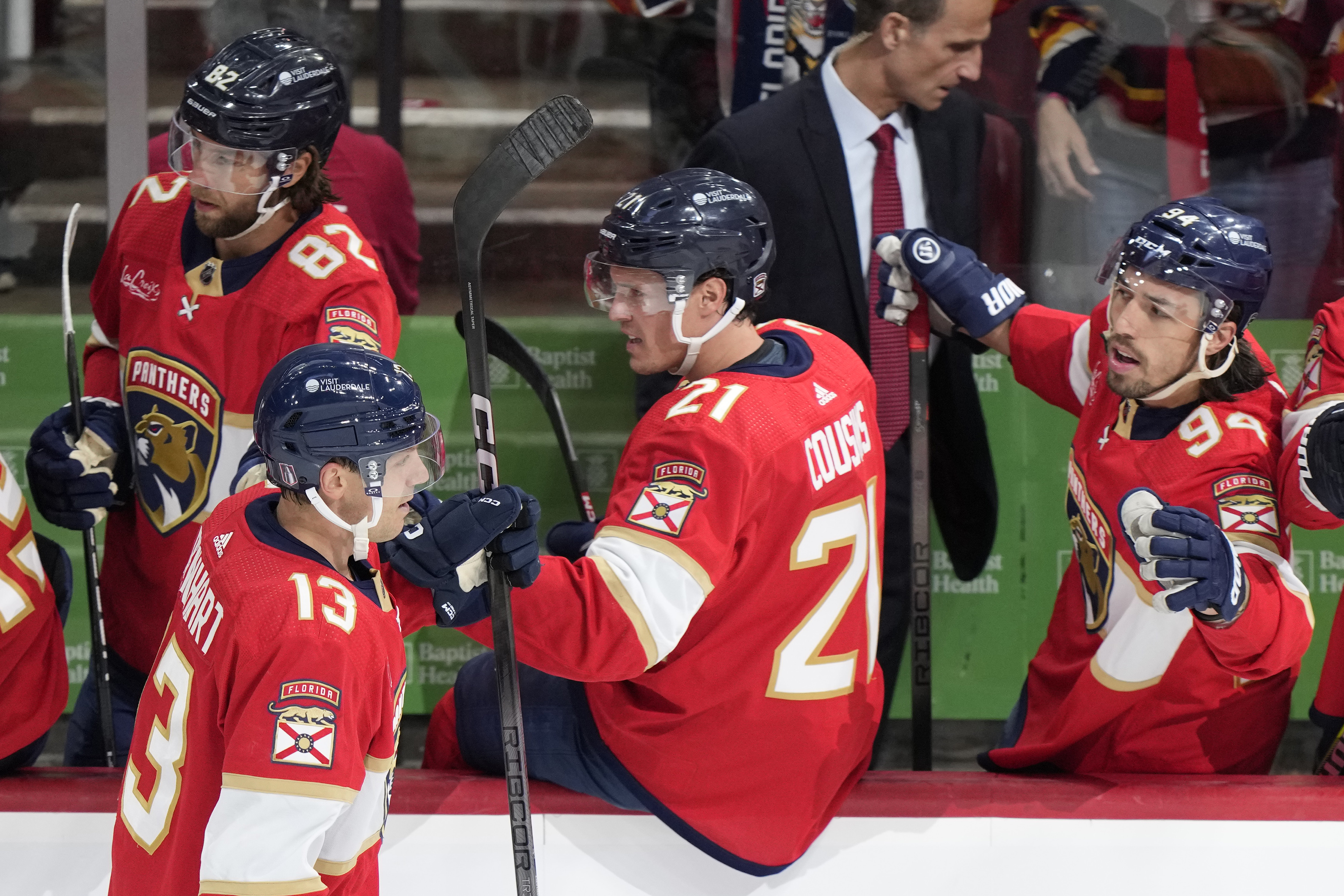 Florida Panthers center Sam Reinhart (13) is congratulated by teammates after he scored during the first period of Game 1 of the first-round of an NHL Stanley Cup Playoff series against the Tampa Bay Lightning, Sunday, April 21, 2024, in Sunrise, Fla. 
