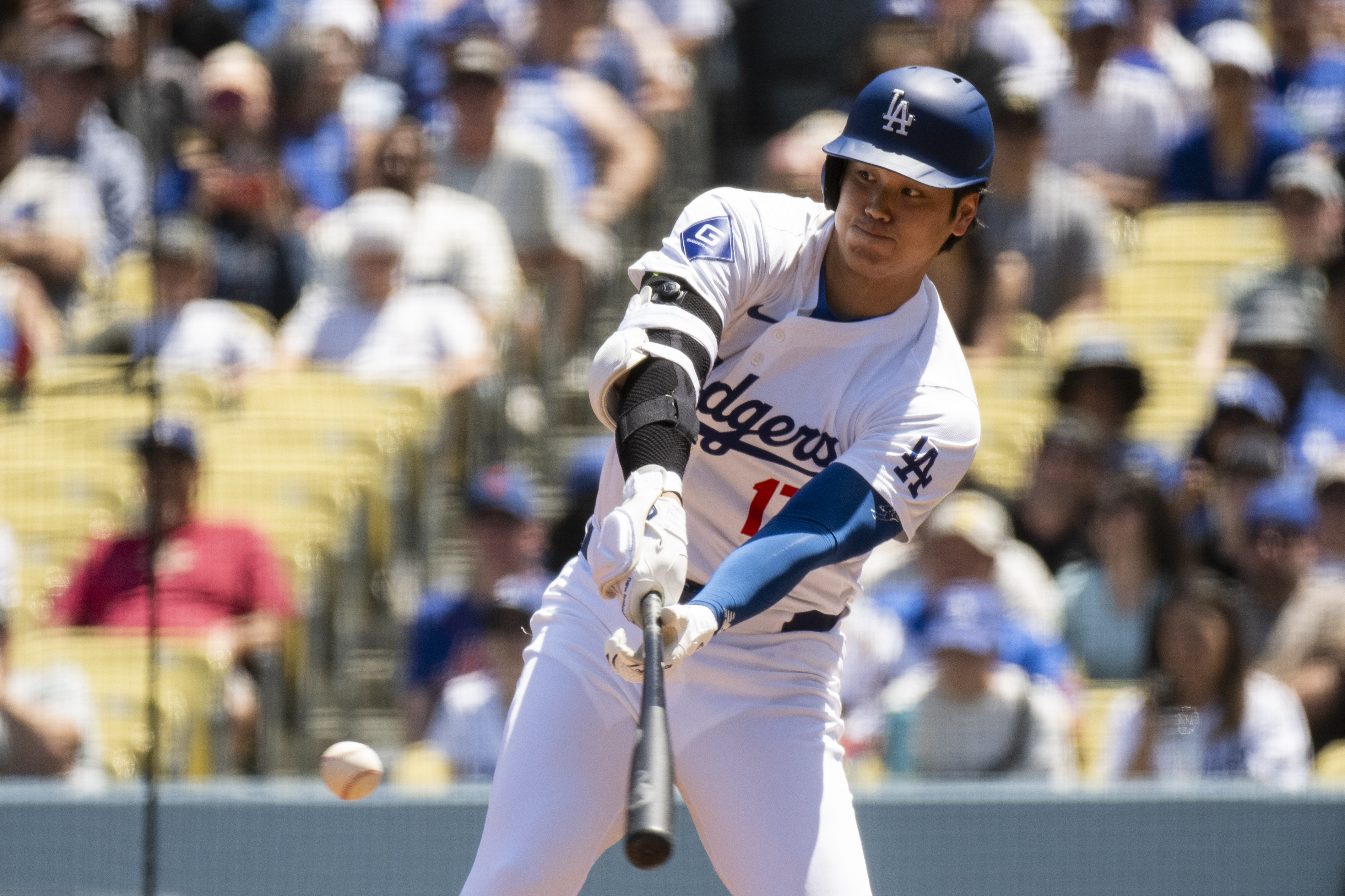 Los Angeles Dodgers' Shohei Ohtani bats during the first inning of a baseball game against the New York Mets in Los Angeles, Sunday, April 21, 2024.
