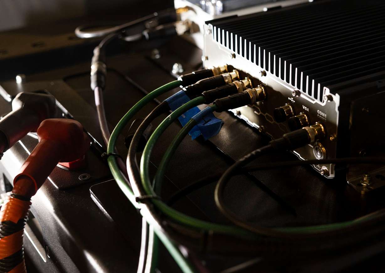 The autonomy controller and battery box of a fully autonomous lawn mower are pictured at FireFly Automatix in Salt Lake City on March 13.