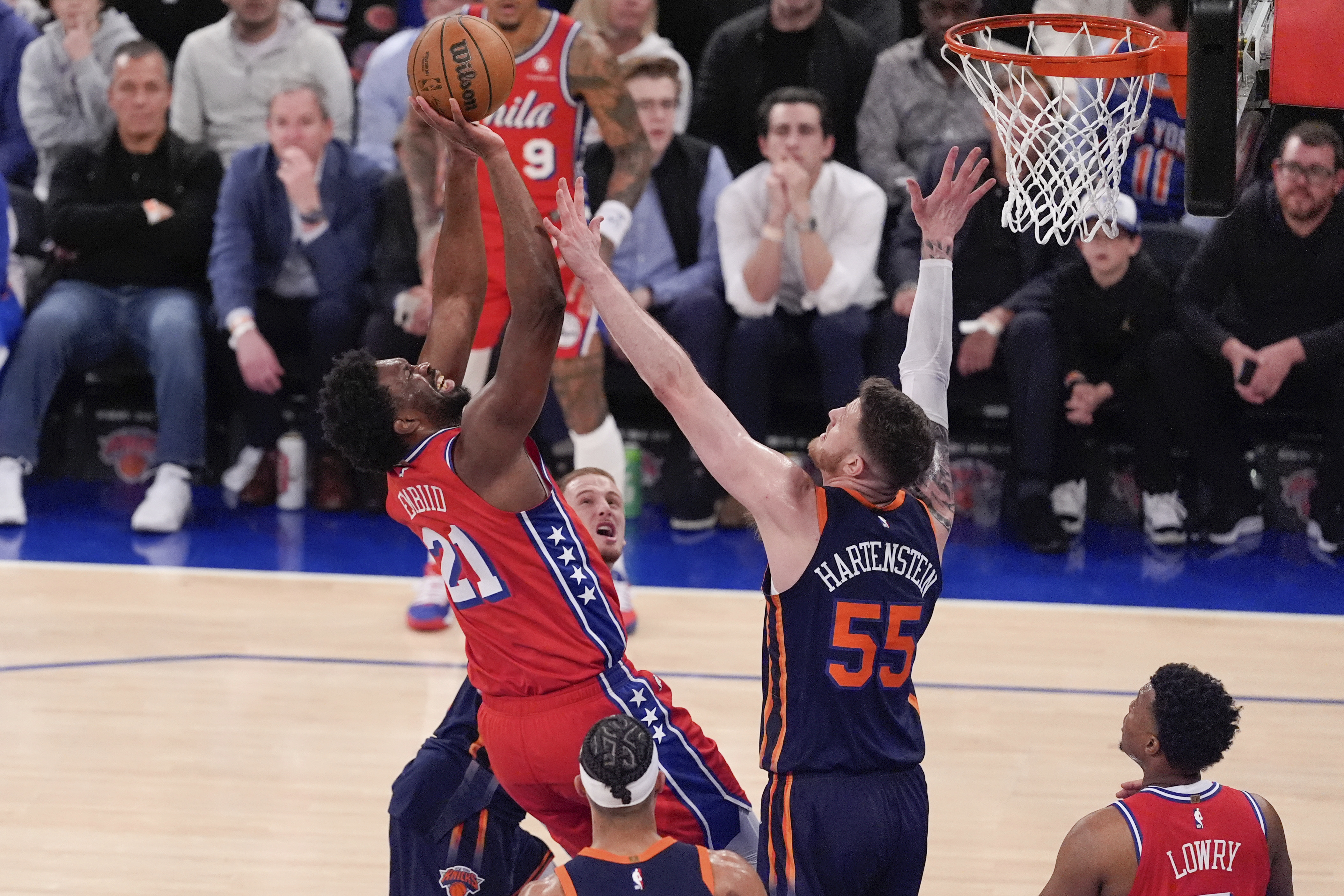 Philadelphia 76ers' Joel Embiid (21) shoots over New York Knicks' Isaiah Hartenstein (55) during the second half of Game 2 in an NBA basketball first-round playoff series Monday, April 22, 2024, in New York.