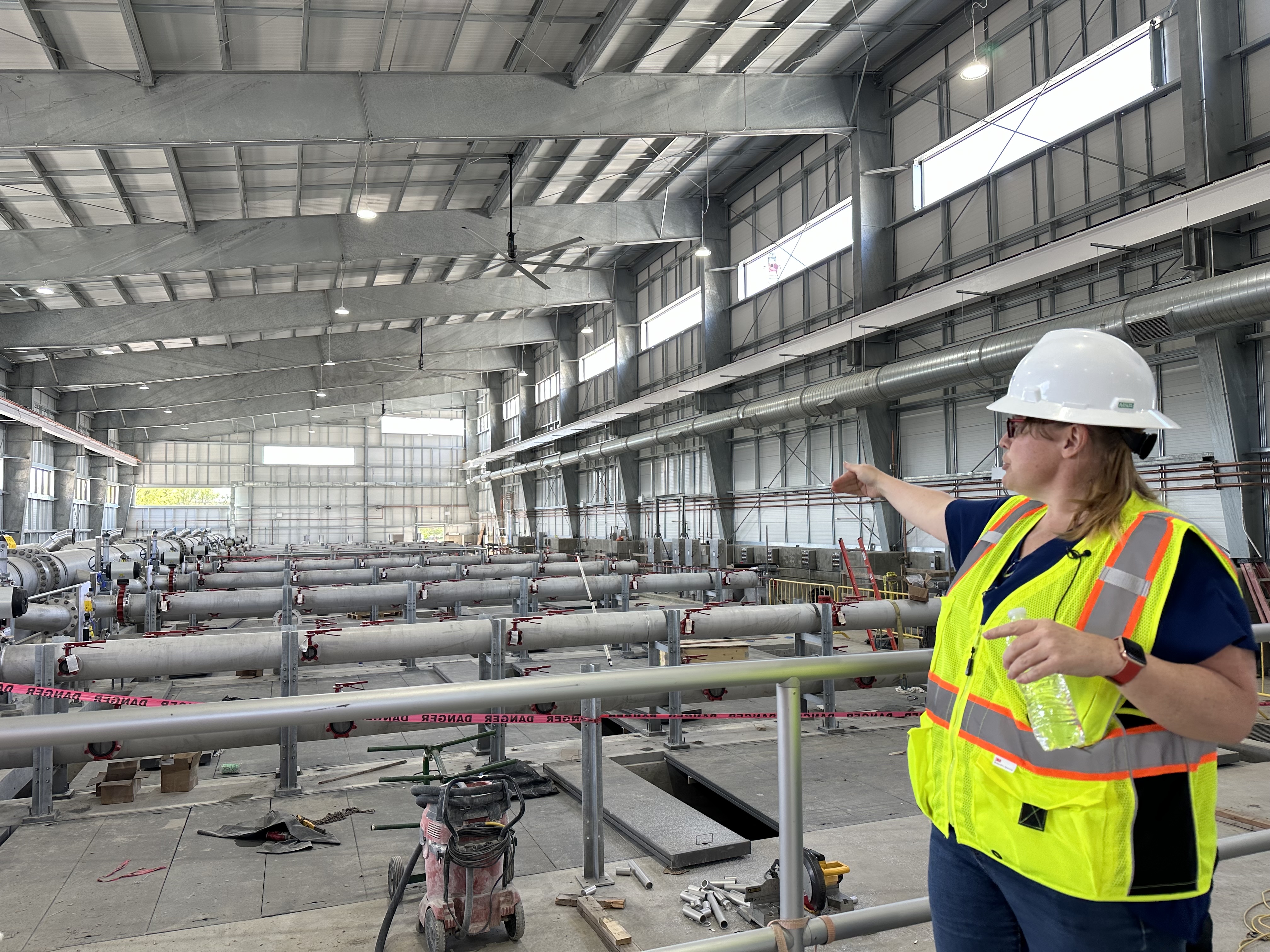 Jenny Calderon, of Waterworks Engineers, gives a tour of a new wastewater treatment plant on Monday in Provo to more efficiently clean sewage water before it goes into Utah Lake.