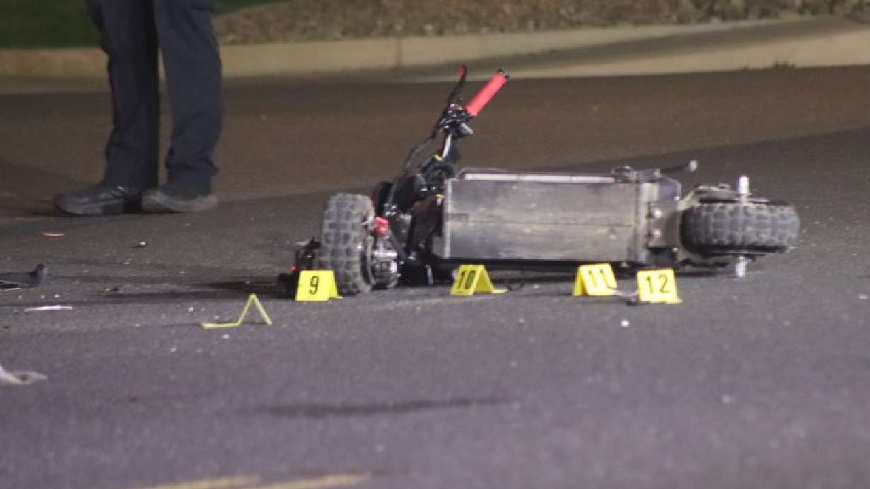 A scooter involved in a suspected DUI crash is lying on its side in St. George on Friday.