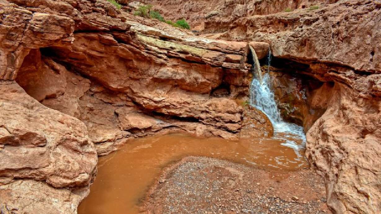 Sulphur Creek Waterfalls at Capital Reef National Park is shown in this updated photo. It is one of the hikes in a Utah waterfall book.