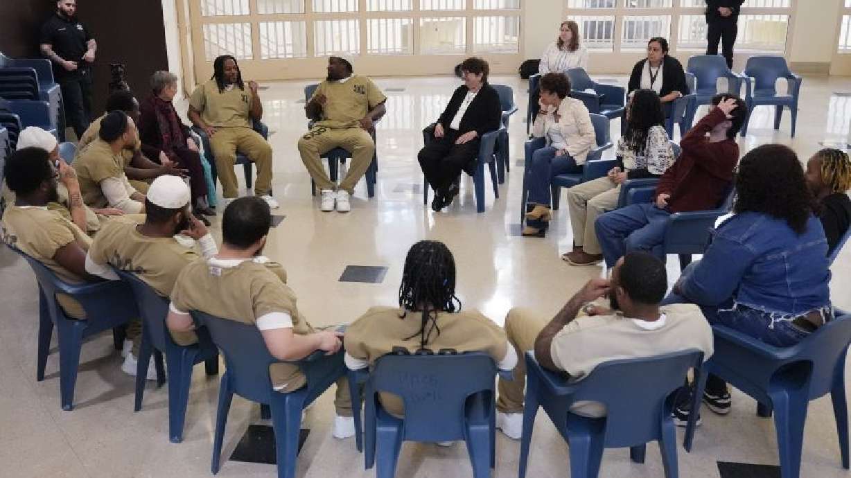 Detainees, DePaul students, and Sister Helen Prejean attend a book club at Department of Corrections Division 11 in Chicago, Monday.