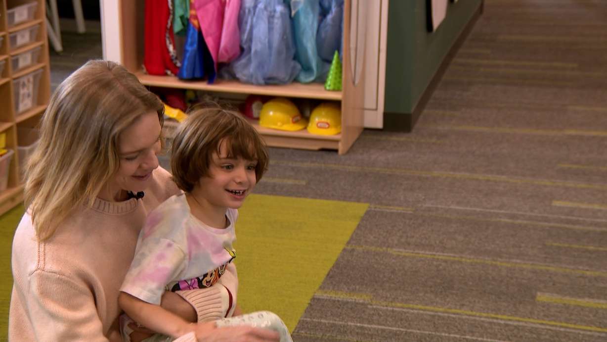 Natalia Vodianova plays with one of the kids at ASSERT.