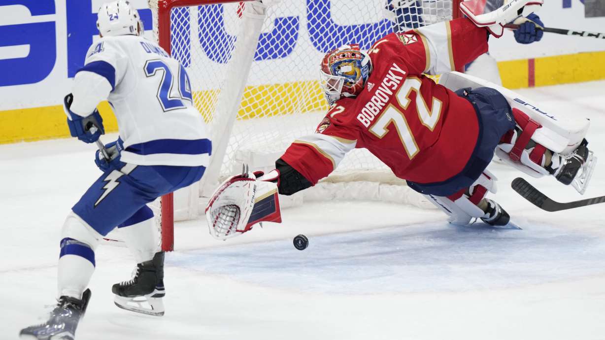 Florida Panthers goaltender Sergei Bobrovsky (72) blocks a shot by Tampa Bay Lightning defenseman Matt Dumba (24) during the second period of Game 2 of the first-round of an NHL Stanley Cup Playoff series, Tuesday, April 23, 2024, in Sunrise, Fla.