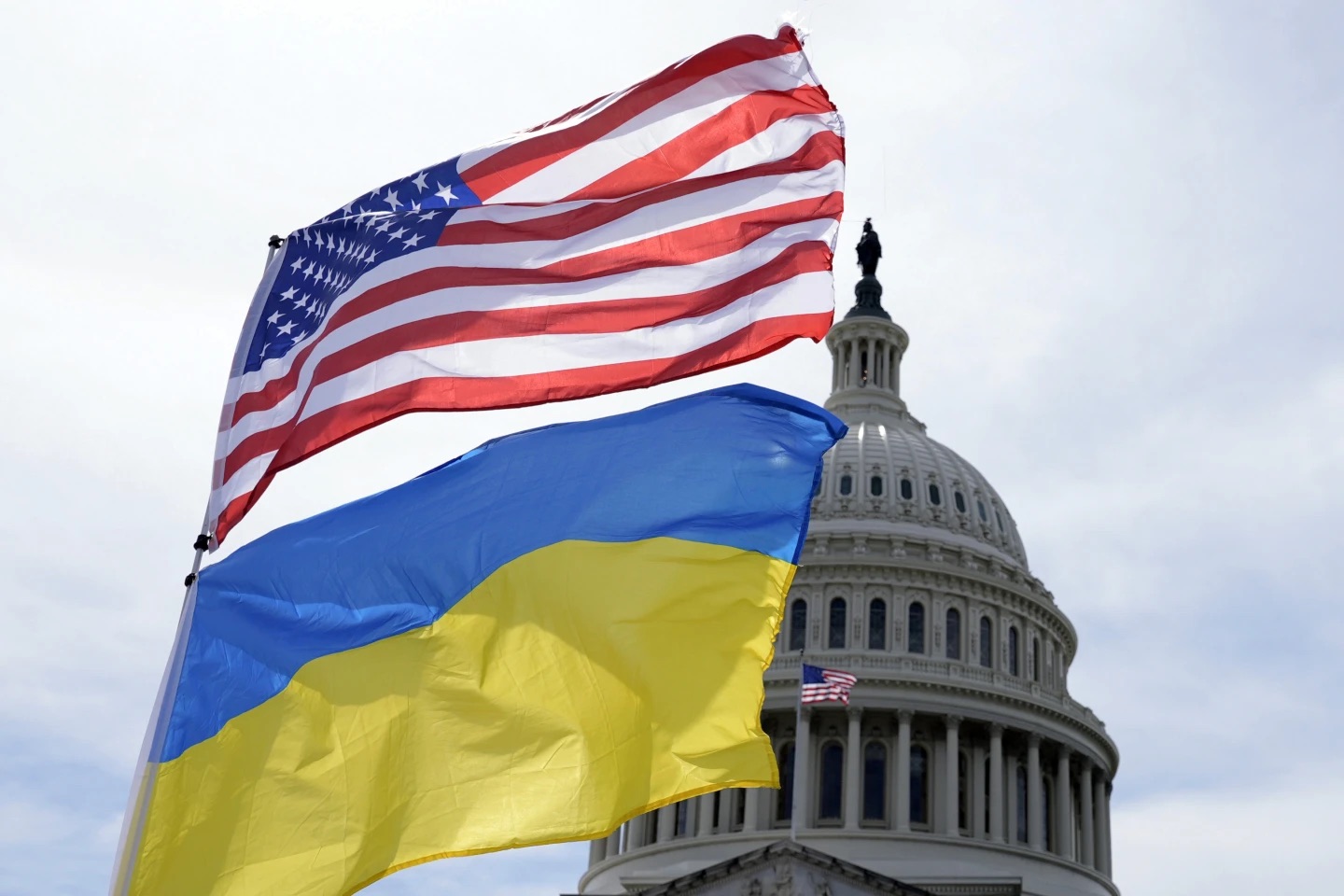 The U.S. flag and the flag of Ukraine are on display outside the Capitol on Monday in Washington.