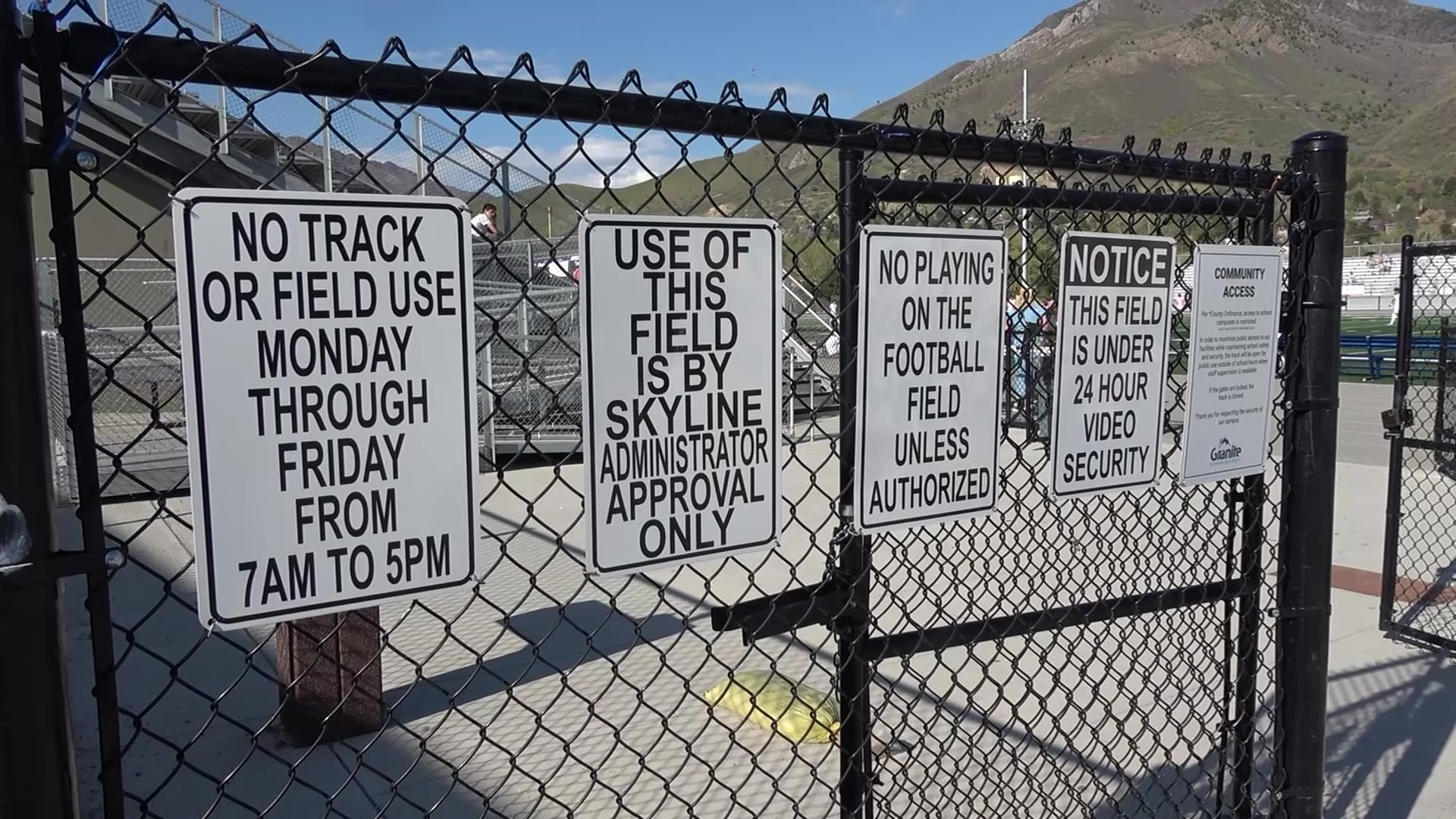 Signs on one of the tennis courts at Skyline High School in Salt Lake City list the community rules.