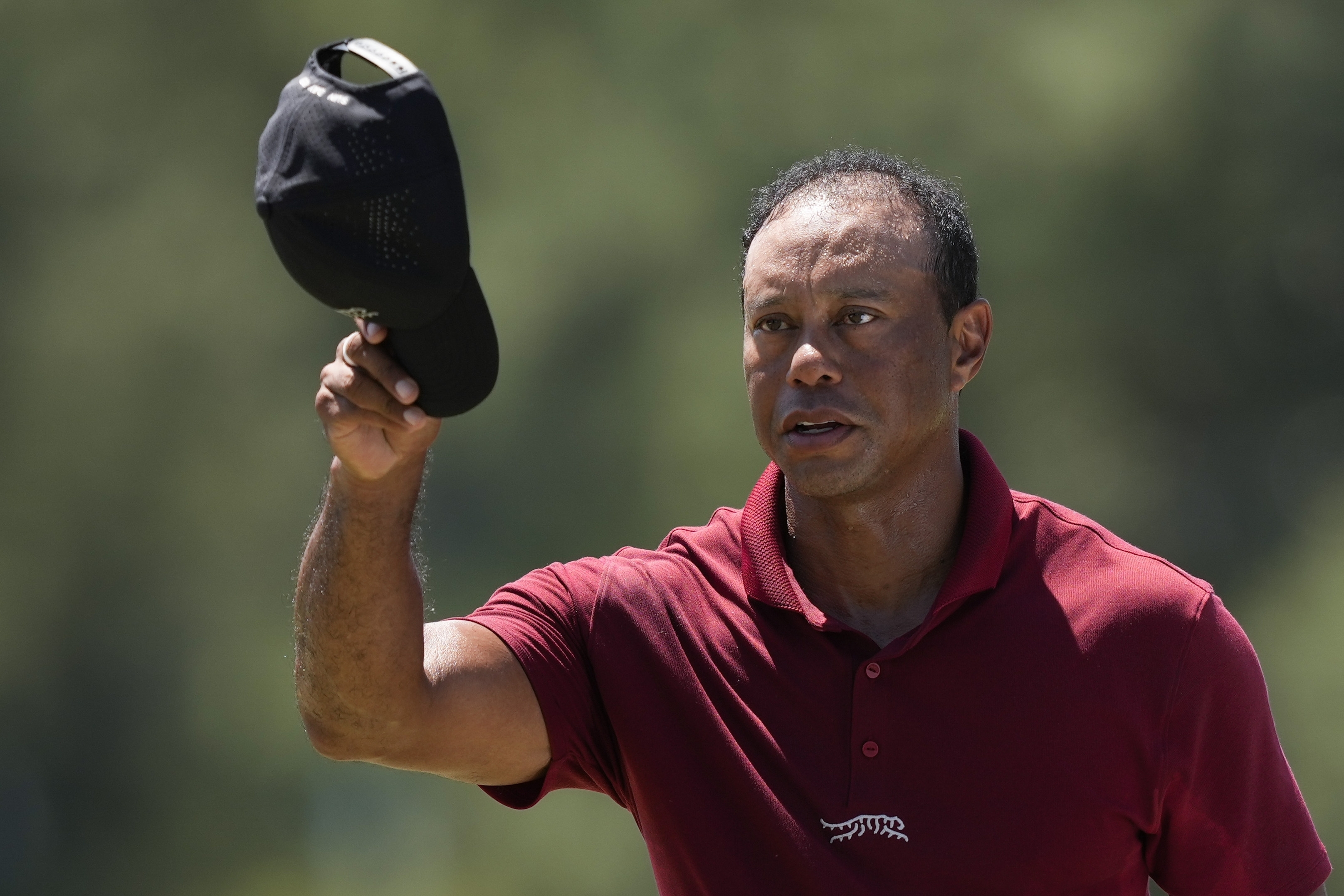 Tiger Woods waves after his final round at the Masters golf tournament at Augusta National Golf Club Sunday, April 14, 2024, in Augusta, Ga.