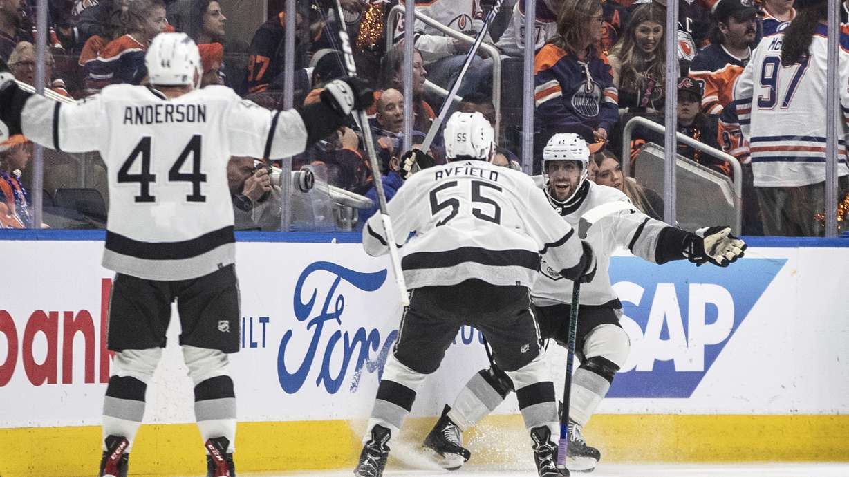 Los Angeles Kings' Mikey Anderson (44), Quinton Byfield (55) and Anze Kopitar (11) celebrate Kopitar's overtime goal against the Edmonton Oilers in Game 2 of an NHL hockey Stanley Cup first-round playoff series Wednesday, April 24, 2024, in Edmonton, Alberta.