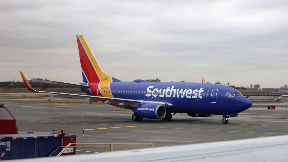 A Southwest Airlines plane at LaGuardia Airport in New York. Southwest announced Thursday it is dropping services at four airports due to delays in deliveries of new jets by Boeing.