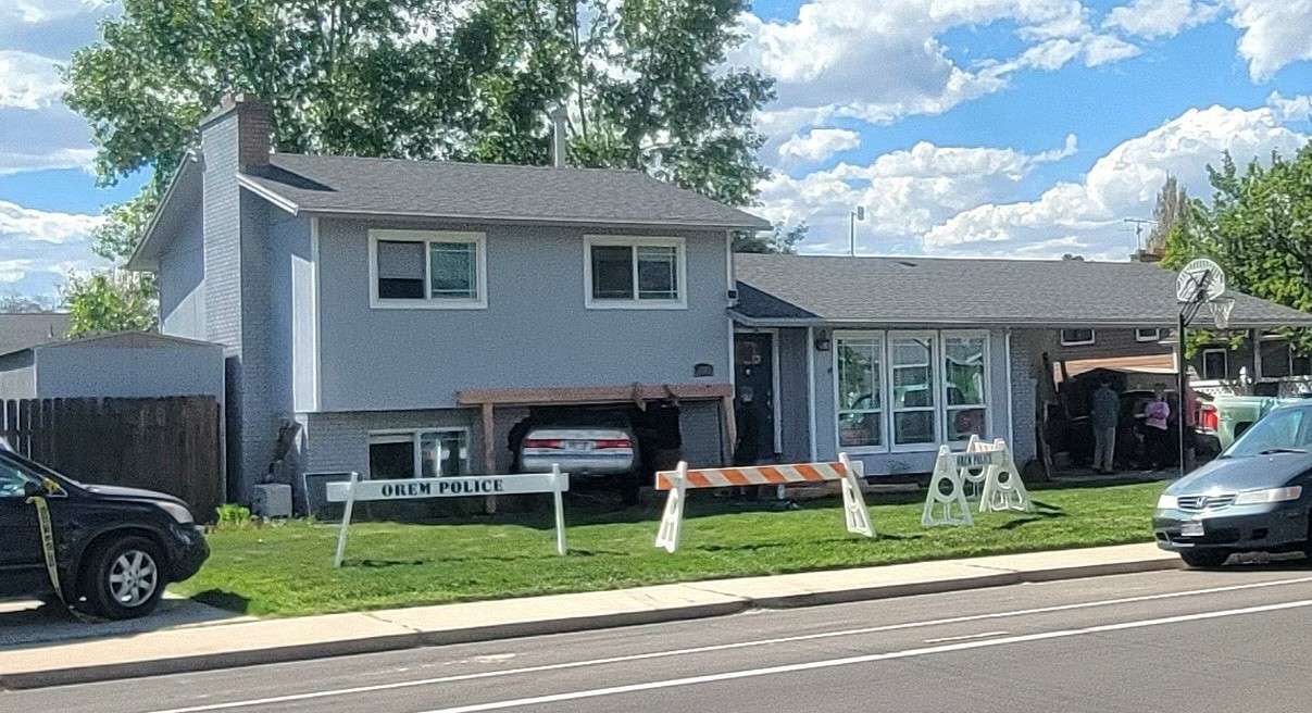 A car was pushed into an Orem home by another vehicle Wednesday morning.
