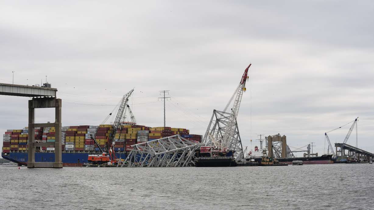 A bulk carrier moves through a newly opened deep-water channel in Baltimore, Thursday, after being stuck in the harbor since the Francis Scott Key Bridge collapsed four weeks ago.
