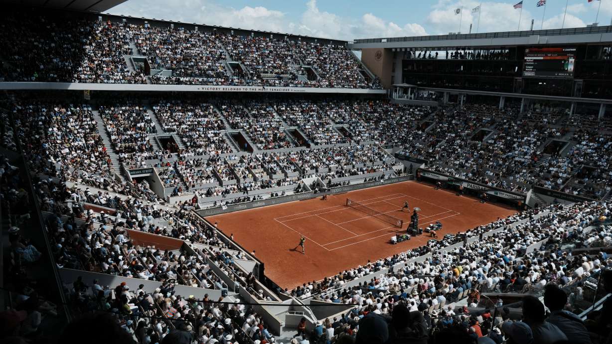 The crowd watch Norway's Casper Ruud playing Spain's Rafael Nadal on the court Philippe Chatrier, known as center court, during their final match of the French Open tennis tournament at the Roland Garros stadium Sunday, June 5, 2022 in Paris. The Roland Garros stadium will host the tennis competitions during the Paris 2024 Olympic Games.