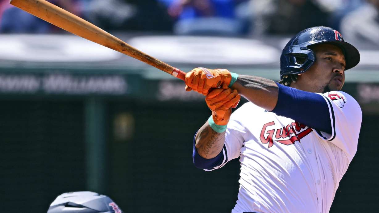 Cleveland Guardians' Jose Ramirez watches the ball after hitting a grand slam off Boston Red Sox starting pitcher Chase Anderson during the second inning of a baseball game, Thursday, April 25, 2024, in Cleveland.