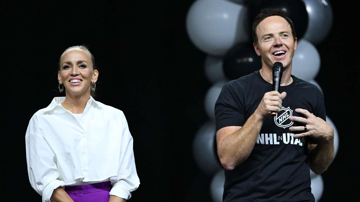 Ryan Smith, co-founder and chairman of Smith Entertainment Group, and Ashley Smith, co-founder of Smith Entertainment Group, thank the fans for attending the NHL event at the Delta Center in Salt Lake City, as Utah’s NHL hockey team is introduced to fans on Wednesday, April 24, 2024.
