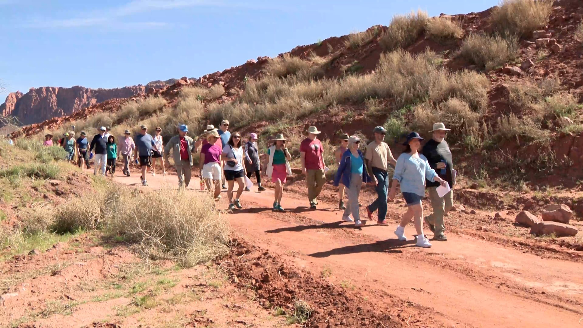 A group of hikers on a trail in the Dry Wash area of Ivins.