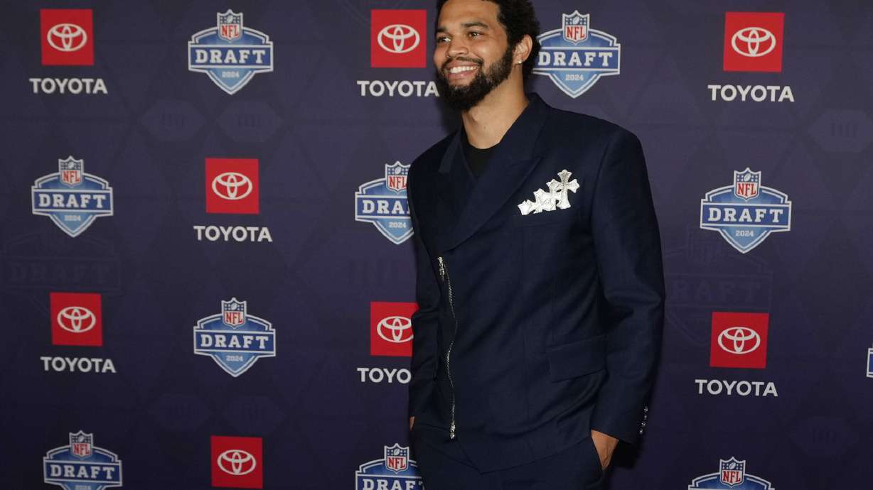 Southern California quarterback Caleb Williams poses on the red carpet ahead of the first round of the NFL football draft, Thursday, April 25, 2024, in Detroit.