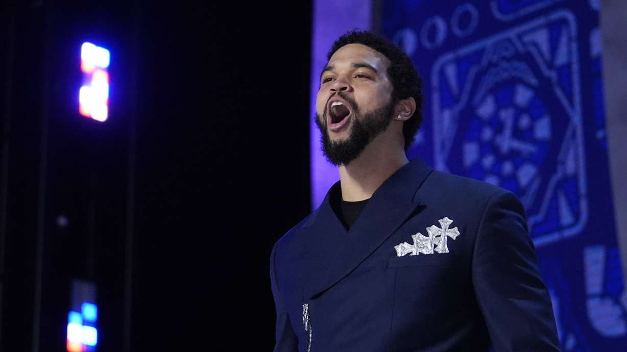 Southern California quarterback Caleb Williams walks on stage before the first round of the NFL football draft, Thursday, April 25, 2024, in Detroit.