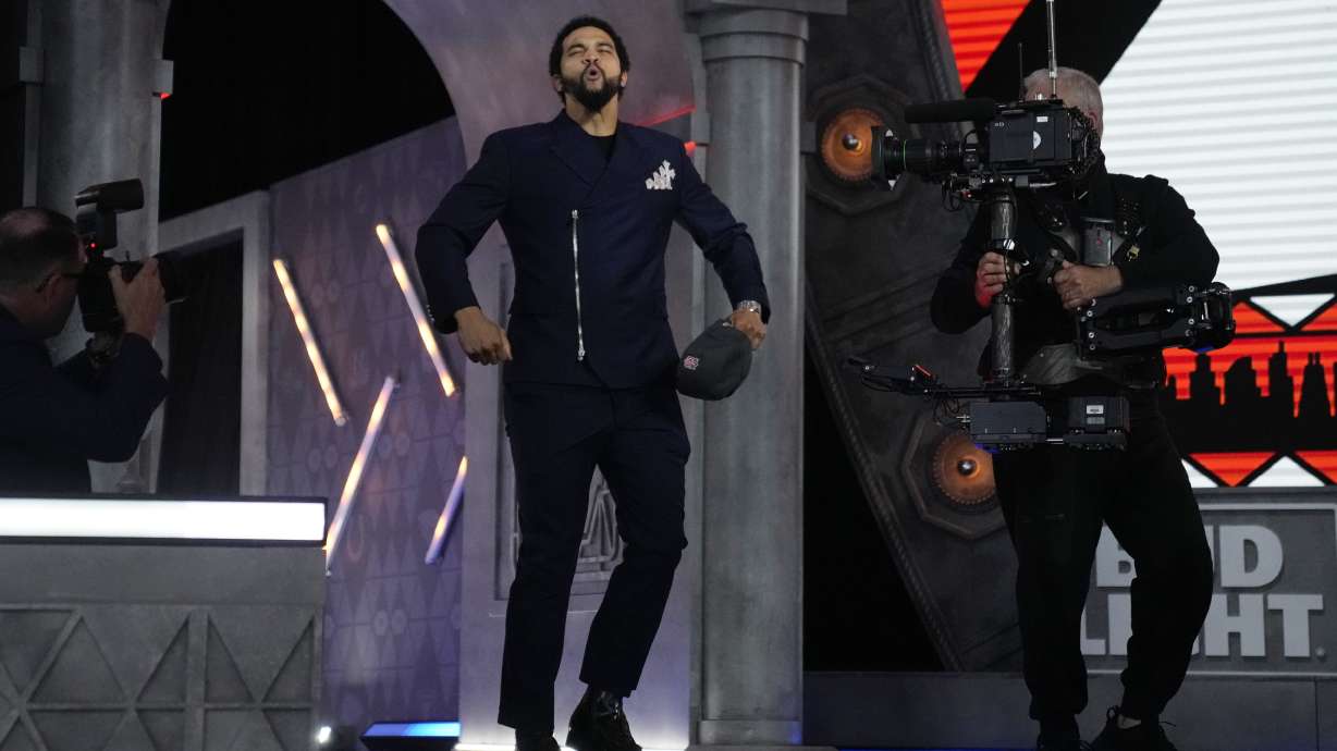 Southern California quarterback Caleb Williams celebrates after being chosen by the Chicago Bears with the first overall pick during the first round of the NFL football draft, Thursday, April 25, 2024, in Detroit.