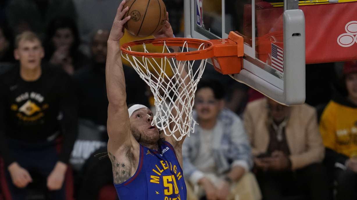 Denver Nuggets forward Aaron Gordon (50) dunks during the first half of Game 3 of an NBA basketball first-round playoff series against the Los Angeles Lakers in Los Angeles, Thursday, April 25, 2024.
