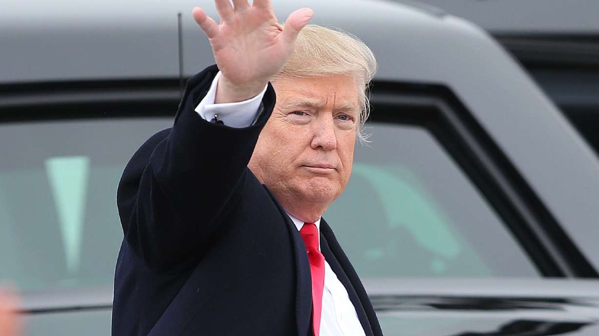 Then-President Donald Trump waves to the crowd at Roland R. Wright Air National Guard Base in Salt Lake City on Dec. 4, 2017. Trump will come to Utah on June 27 to fundraise for his reelection campaign.