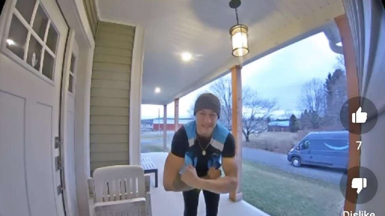 Amazon delivery driver shows off to doorbell camera in this YouTube short.