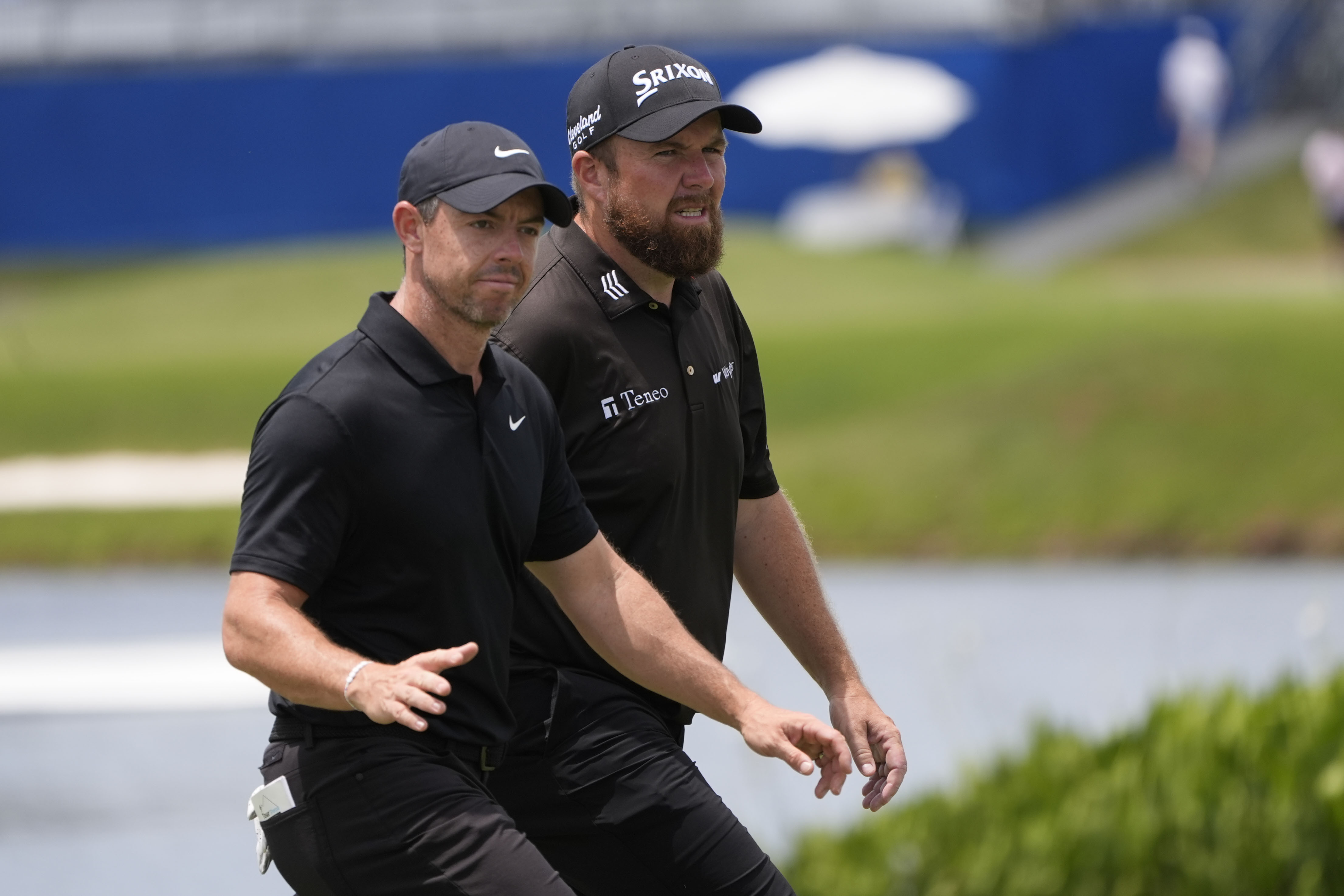 Rory McIlroy, of Northern Ireland, acknowledges the crowd as he walks onto the ninth green with teammate Shane Lowry, of Ireland, during the second round of the PGA Zurich Classic golf tournament at TPC Louisiana in Avondale, La., Friday, April 26, 2024.