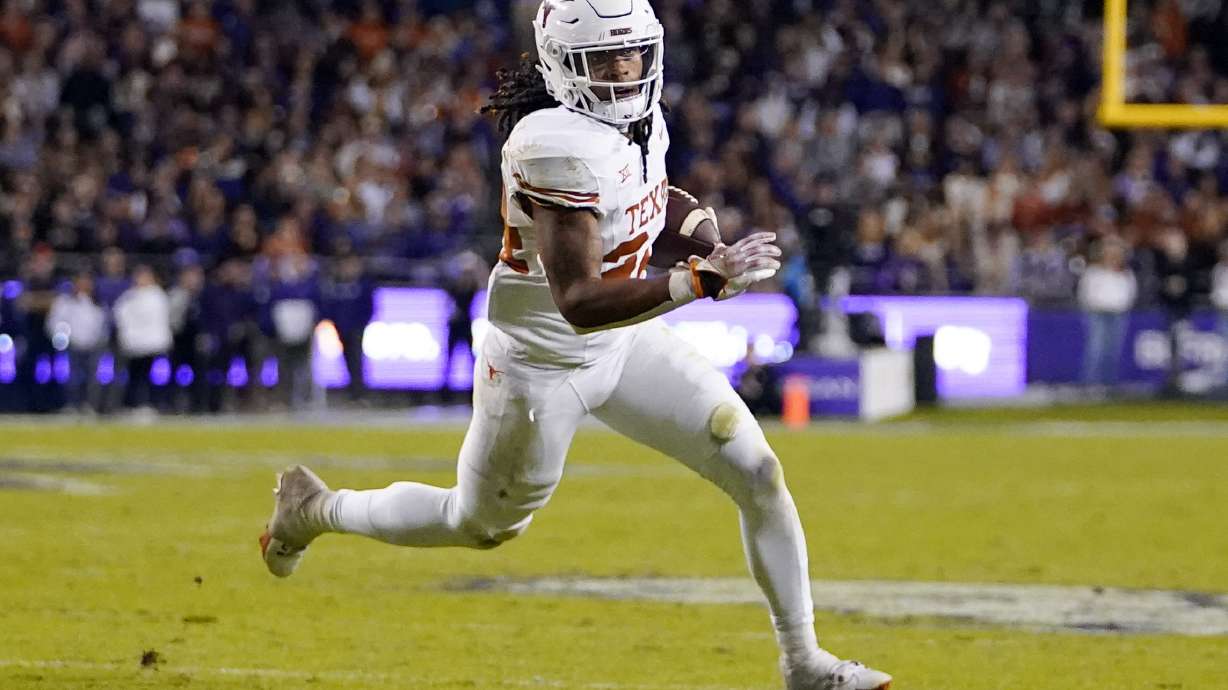 FILE - Texas running back Jonathon Brooks runs free before scoring a touchdown against TCU during the first half of an NCAA college football game, Saturday, Nov. 11, 2023, in Fort Worth, Texas. The Dallas Cowboys are resetting at running back eight years after drafting Ezekiel Elliott. Brooks, who is recovering from a major knee injury, is the highest-rated running back in the draft, according to nfl.com, and the only one among the top 30 prospects.