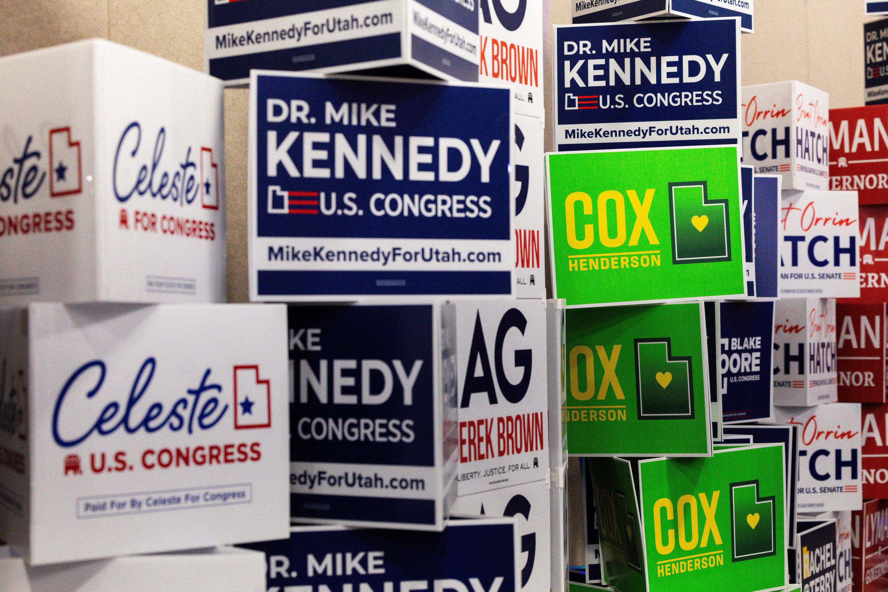 Signs are pictured in the expo hall during the Utah Republican Party state nominating convention at the Salt Palace Convention Center in Salt Lake City on Saturday.
