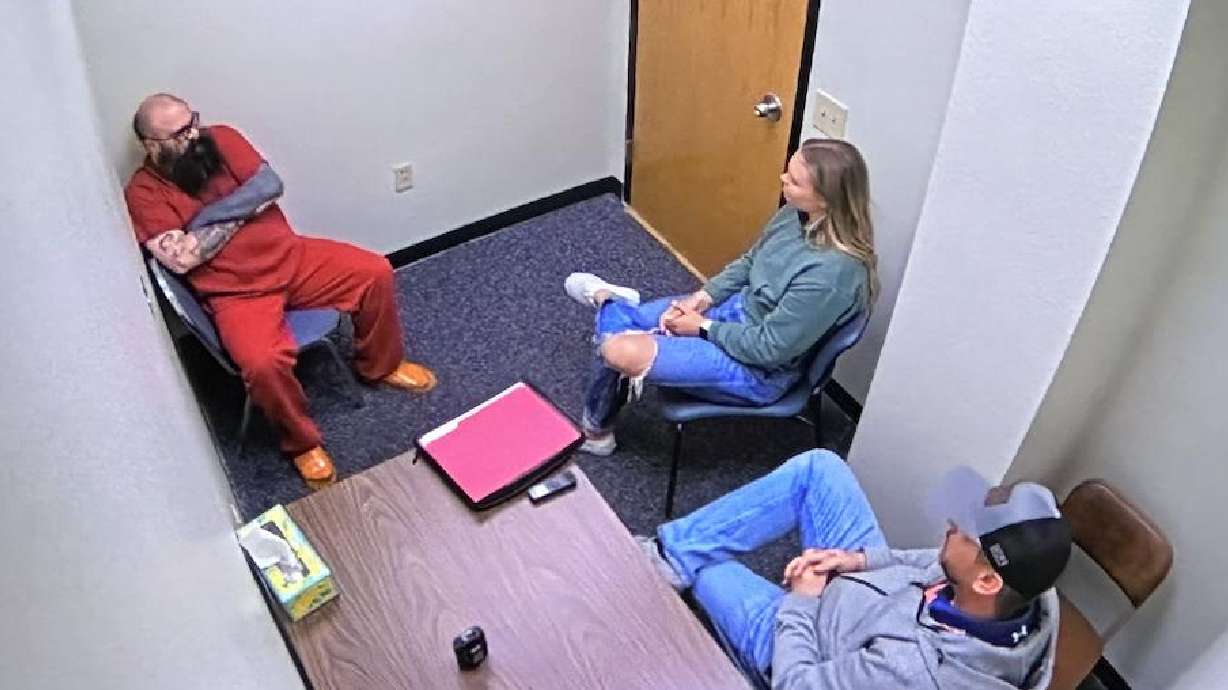 Santa Clara police interview Thomas Snyder in an interview room in Reno, Nevada, on Saturday. He is charged with sexually abusing a young teen girl in southern Utah he had offered to pay to model for him.