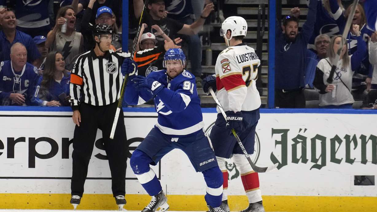 Tampa Bay Lightning center Steven Stamkos (91) celebrates his goal in front of Florida Panthers center Eetu Luostarinen (27) during the first period in Game 4 of an NHL hockey Stanley Cup first-round playoff series, Saturday, April 27, 2024, in Tampa, Fla.